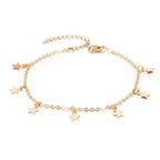 Gold-toned star charm anklet jewelry featuring a delicate silver chain and lobster clasp for star fashion anklet style