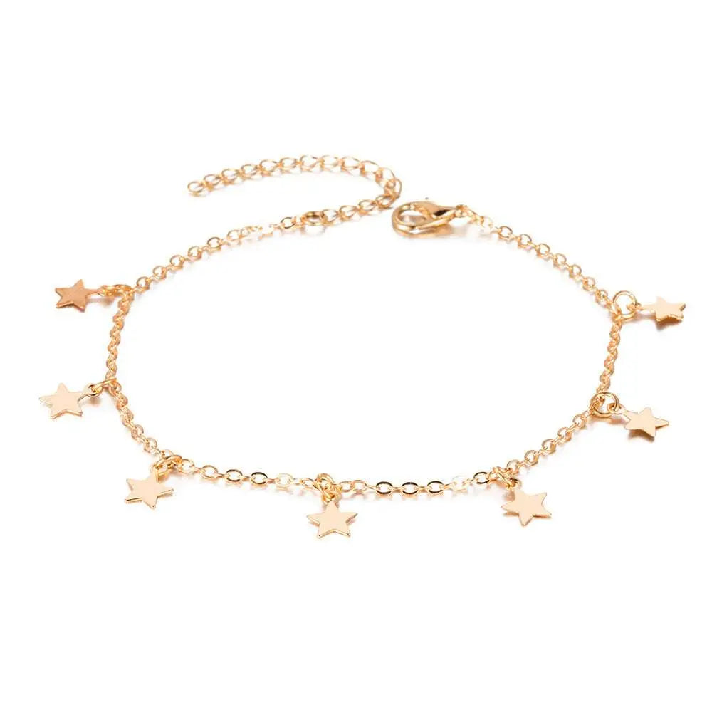 Gold-toned star charm anklet jewelry featuring a delicate silver chain and lobster clasp for star fashion anklet style