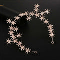 Delicate rose gold star-shaped starry hair band with rhinestones and elegant curved metallic design