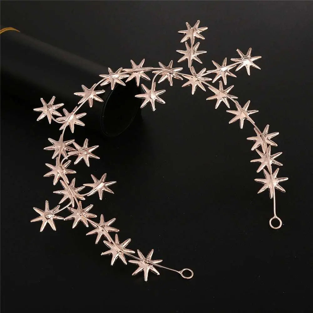 Delicate rose gold star-shaped starry hair band with rhinestones and elegant curved metallic design