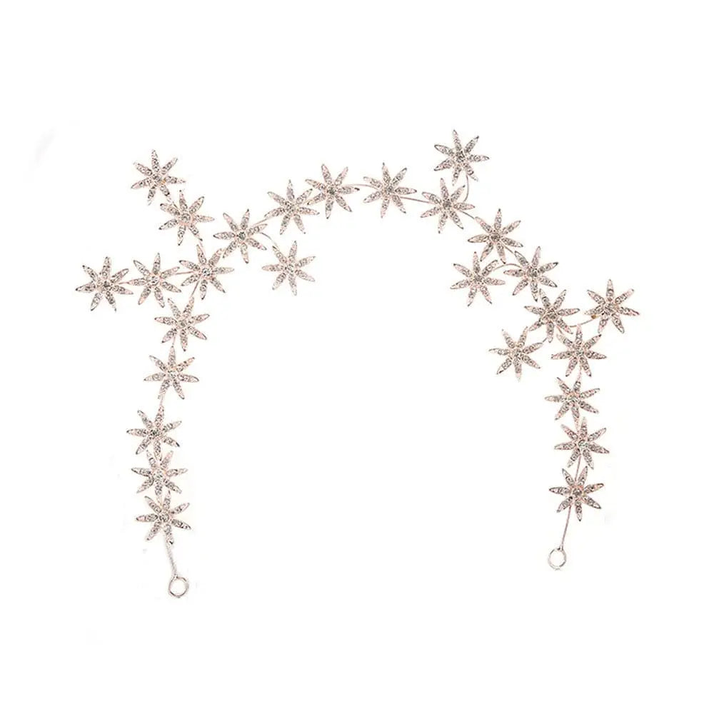 A delicate silver starry hair band with rhinestone starry hair design for an elegant hair accessory