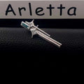 Silver star y2g hairpin featuring a silver tie clip with stylized dagger design and clear green rectangular gemstones