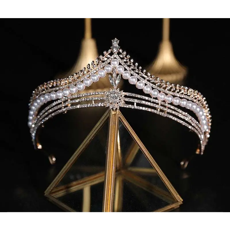 Silver bridal crown featuring baroque pearls and diamonds with a starburst design in a crown baroque style