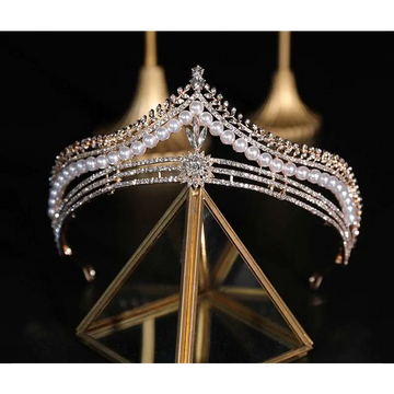 Silver bridal crown featuring baroque pearls and diamonds with a starburst design in a crown baroque style