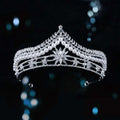 Silver bridal crown baroque pearl tiara with intricate crystal detailing and a central starburst motif