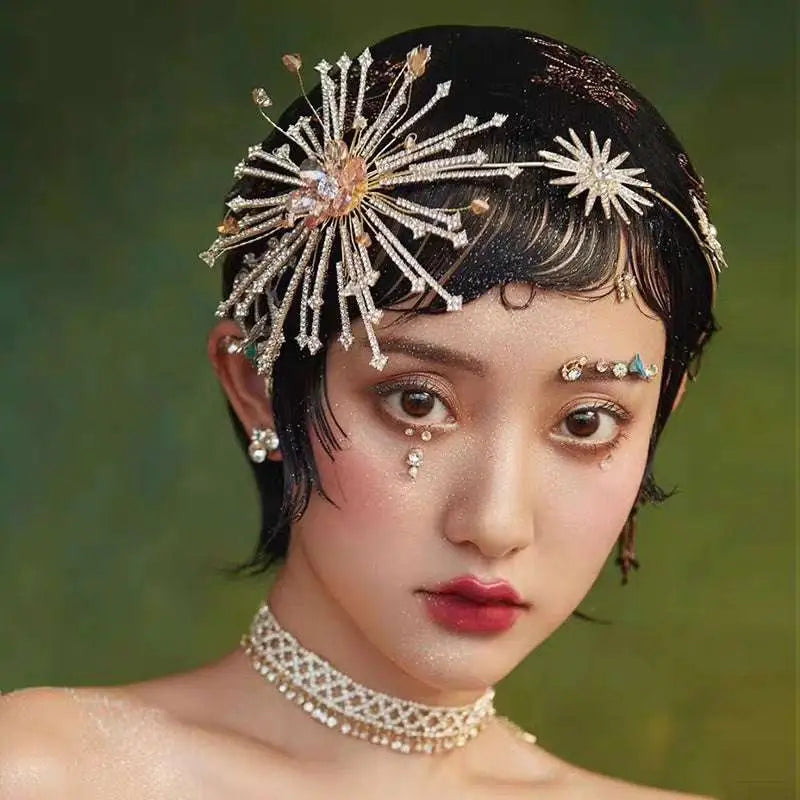 Silver starburst bridal rhinestone headband with crystals gold accents and a central pink gemstone for brides