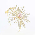 Silver starburst bridal rhinestone headband with delicate gold-toned dandelion design and central pink gemstone flower