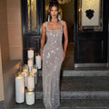 A silver strap sequins net drill suspenders gown with a square neckline and thin straps in a floor-length design