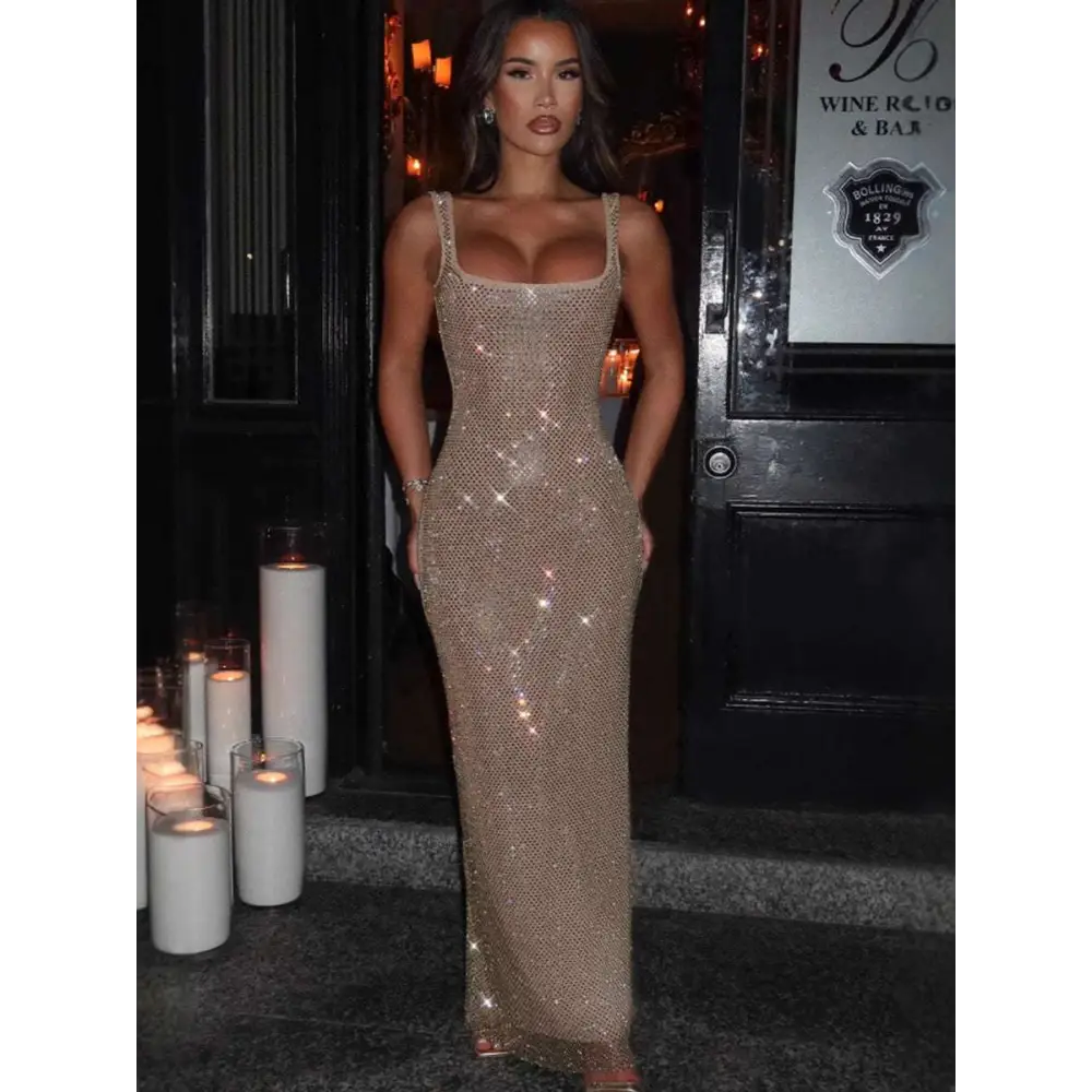 A silver strap sequins net drill suspenders gown with a square neckline and thin straps in a floor-length design