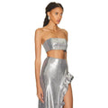 Silver strapless sequin skirt set featuring a shimmering silver sequined crop top and high-slit ruffled skirt
