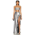 Shimmering silver strapless sequin skirt set featuring a metallic two-piece with crop top and high-slit ruffled maxi skirt
