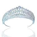 A silver super flash zircon crown tiara with clear faceted crystals arranged in a cascading pattern