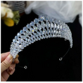 A silver super flash zircon crown tiara featuring a sparkling silver tiara with clear faceted crystals in cascading pattern