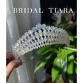 A sparkling gold bridal zircon crown tiara with a cascading array of clear super flash zircon crystals