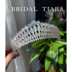 A sparkling gold bridal zircon crown tiara with a cascading array of clear super flash zircon crystals