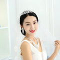 Silver tiara with intricate lace detailing and american rhinestone claw chain showcasing ornate filigree design and sparkle