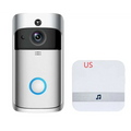 Silver video doorbell smart wireless wifi security camera with black lens and blue button next to white smart speaker