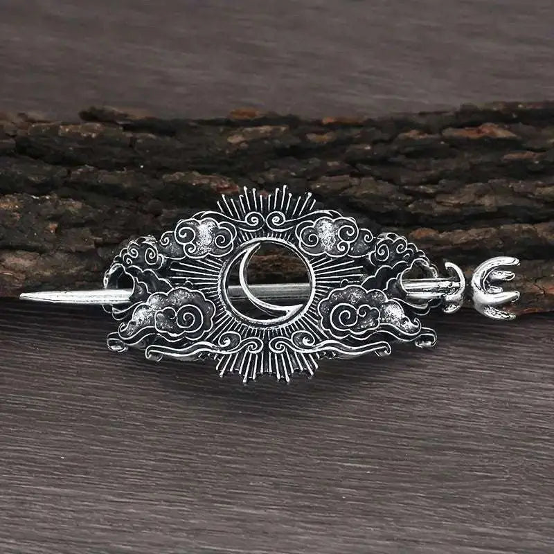 Silver-toned female viking barrettes featuring a metal hairpin with crescent moon and sunburst cloud design