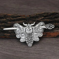 Silver-toned female viking barrettes featuring a silver moth hairpin with intricate wing and skull detailing in alloy