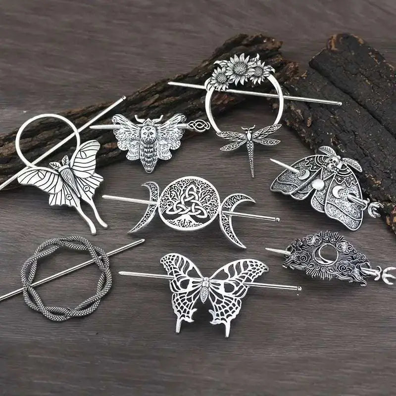 Silver-toned female viking barrettes featuring intricate butterfly moth dragonfly and moon phase designs in metal alloy