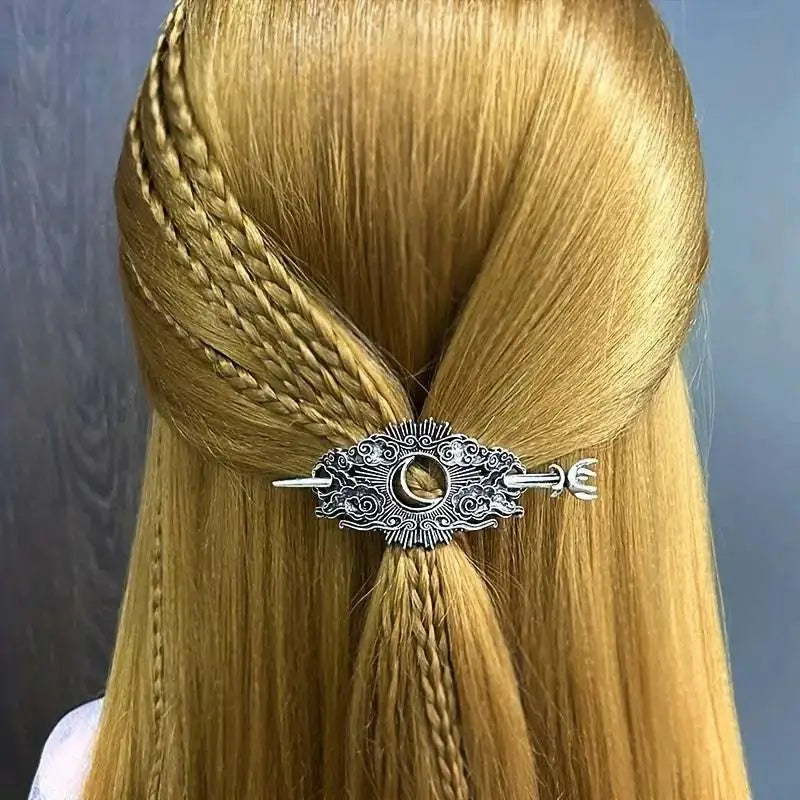 Silver-toned female viking barrettes with intricate filigree and central crescent moon motif in ornate design