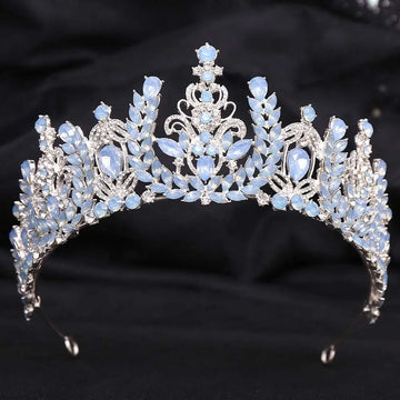 Silver white leafy opal and crystal bridal crown featuring an ornate design with light blue opal stones and clear crystals