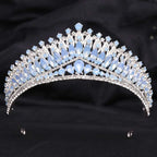 A silver crystal bridal crown featuring white leafy opal and cascading light blue and clear crystals for brides