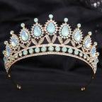 Delicate gold-toned crystal bridal crown featuring white leafy opal and clear crystals in an elegant bridal design