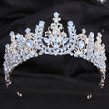 An elegant silver crystal bridal crown featuring white leafy opal and clear crystals in a delicate design