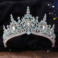 An elegant silver crystal bridal crown featuring white leafy opal and light blue clear crystals in a crown design
