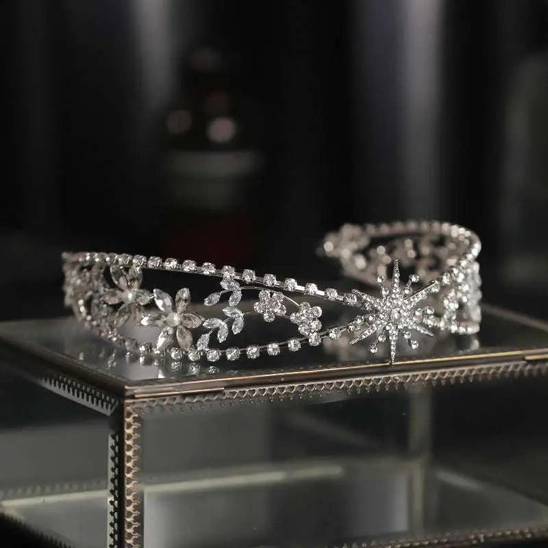 Silver zircon bridal crown headdress with delicate metal framework featuring floral and starburst crystal designs