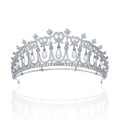 Silver tiara bridal accessory with intricate diamond settings and dangling white pearls for wedding hair adornment