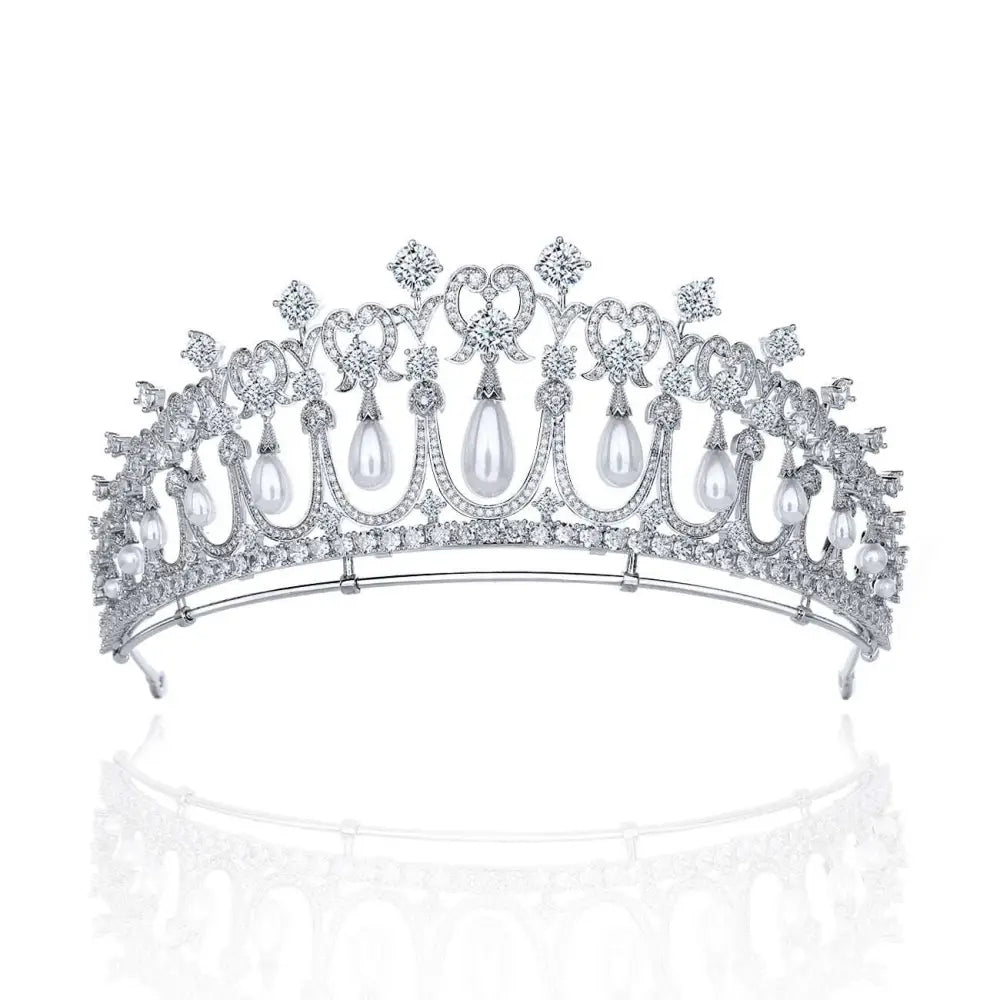 Silver tiara bridal accessory with intricate diamond settings and dangling white pearls for wedding hair adornment