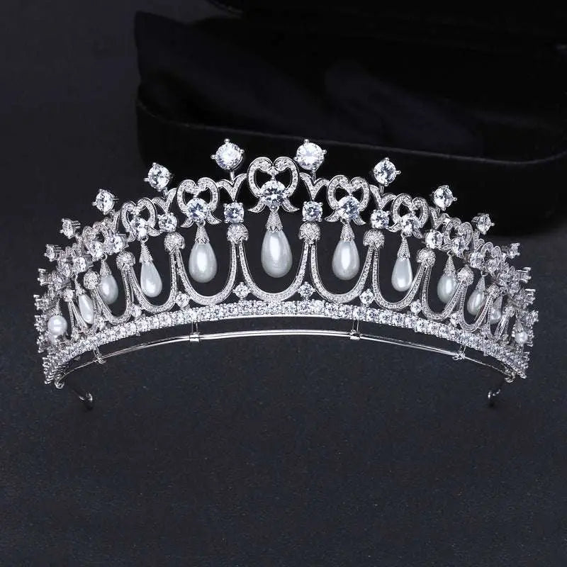 Silver tiara bridal hair accessory featuring clear zircon crystals and dangling white pearls for weddings
