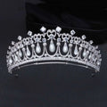 Silver tiara bridal hair accessory with clear zircon crystals and dangling white pearls for weddings