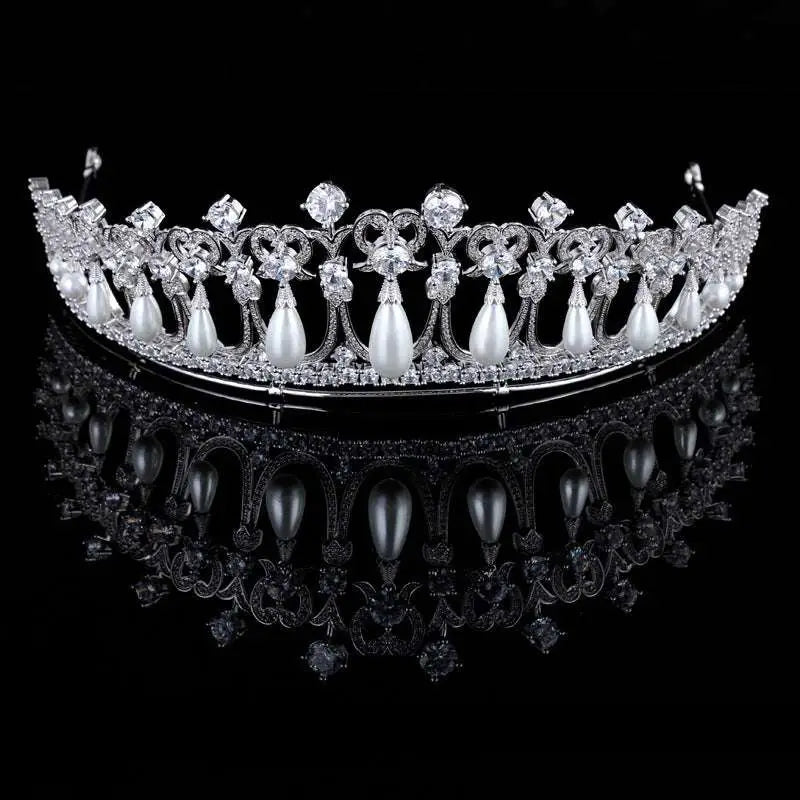 Silver tiara with clear crystals and dangling white pearls designed as bridal wedding hair accessory