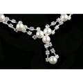 A delicate silver simple bride jewelry pearl necklace with cascading white pearls and clear wedding rhinestones