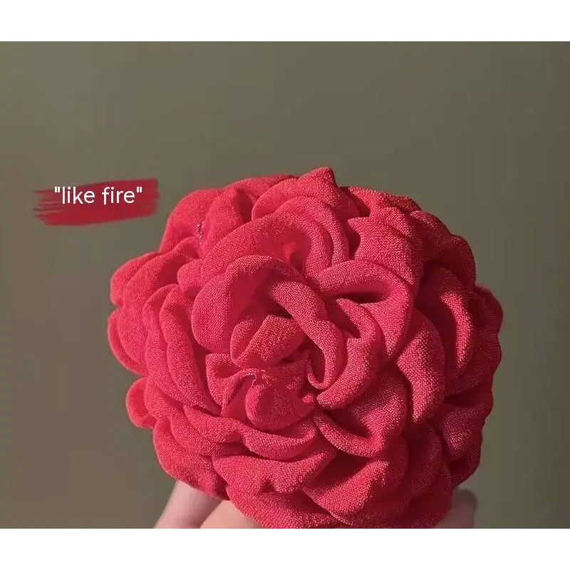 Simple graceful barrettes featuring vibrant red fabric rose hair with layered ruffled petals and soft textured material