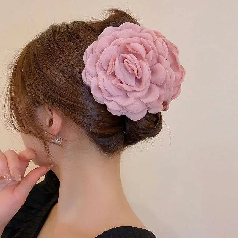 Simple graceful barrettes featuring a delicate pink fabric rose hair clip with layered ruffled petals and soft texture