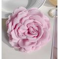 Simple graceful barrettes featuring a delicate pink fabric rose with layered ruffled petals and subtle sheen