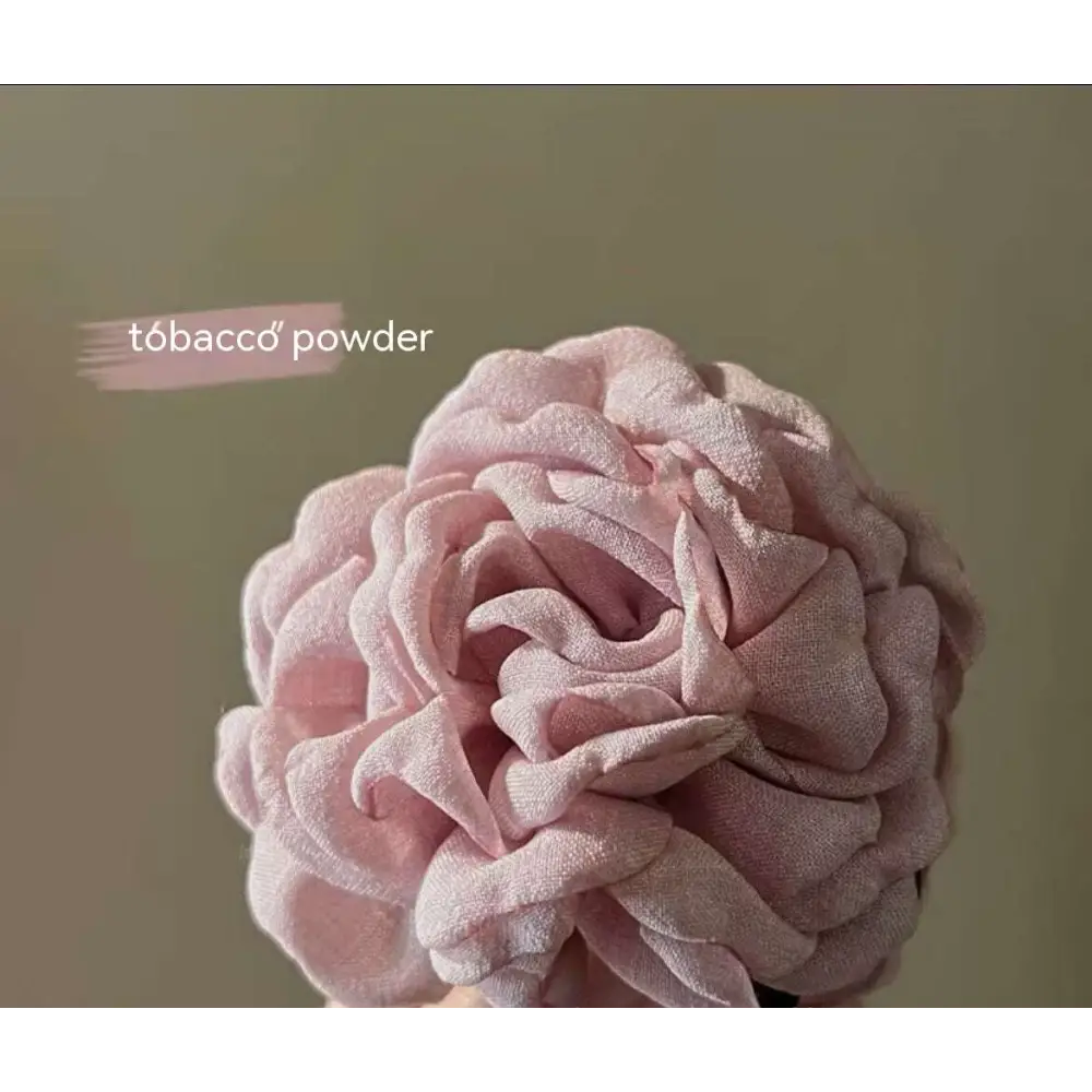 Simple graceful barrettes featuring a delicate light pink fabric rose with layered ruffled petals for fabric rose hair styles