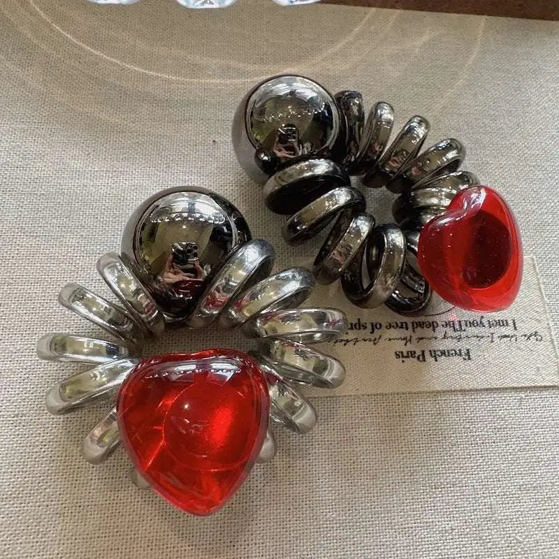 Shiny chrome spiral hair clips with graceful red love heart accents for red love phone line hair styling