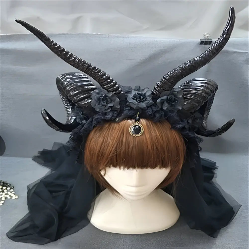 Black simulation horn lace dark witch headband with floral embellishments and central ornate pendant