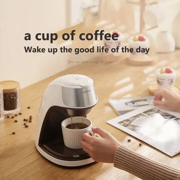White and silver konka fully automatic single serve portable coffee machine with stainless steel drip tray pouring dark coffee