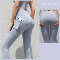 Light gray high-waisted gym sport seamless leggings with built-in side pocket holding a smartphone