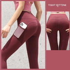 Maroon high-waisted gym sport seamless leggings with side pocket holding a smartphone for active use