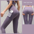 Slate blue high-waisted gym sport seamless leggings with side pocket holding a white smartphone for active use