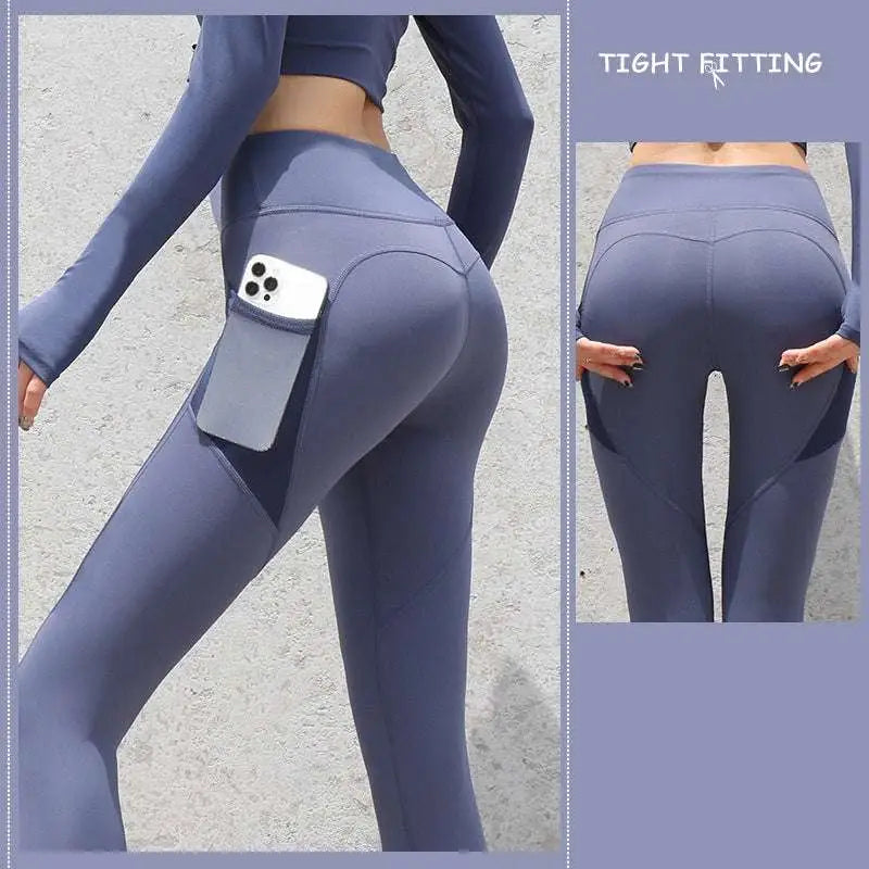 Slate blue gym sport seamless leggings with high-waisted fit and pocket holding a smartphone securely