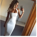 A sleek white form fitting halter sexy dress with a single shoulder design ideal for elegant occasions