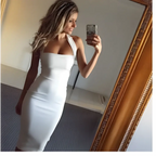 A sleek white form fitting halter sexy dress with a single shoulder design ideal for elegant occasions